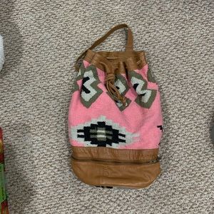 Urban Outfitters Pink patterned one strap backpack